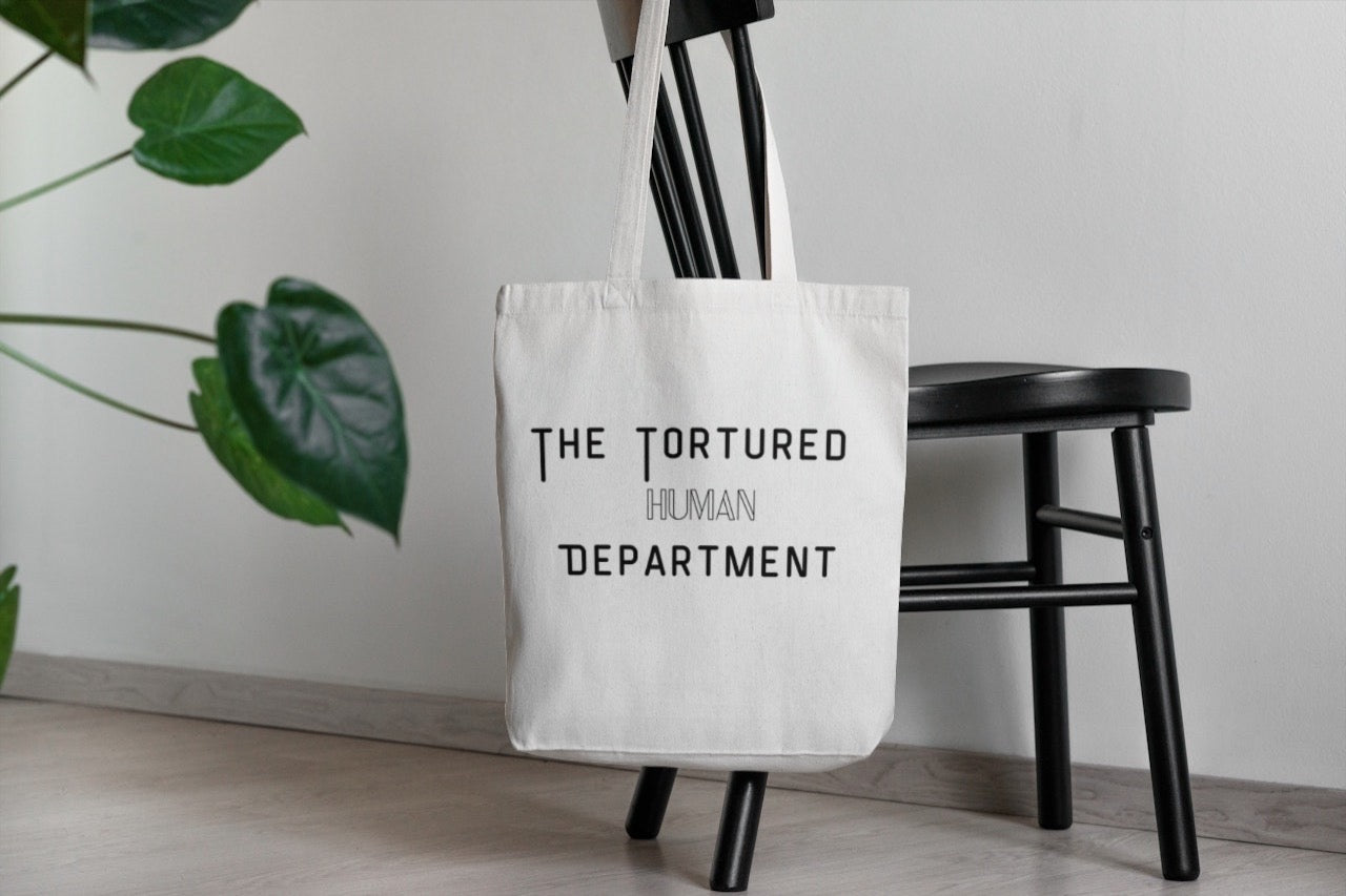 ‘The Tortured Human Department’ Tote Bag